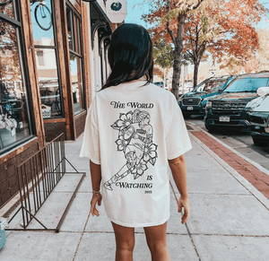 "The World is Watching" Tee - Modish Rugger